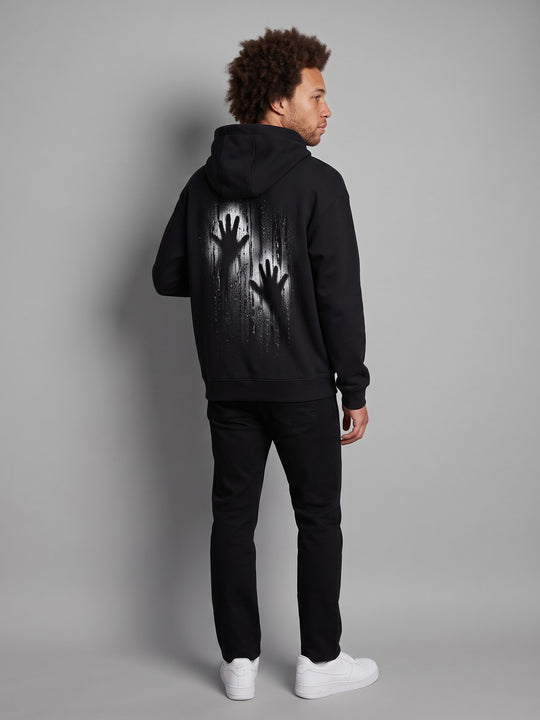 Condensation Hands Hoodie in black, back view on a model – NO BHVR