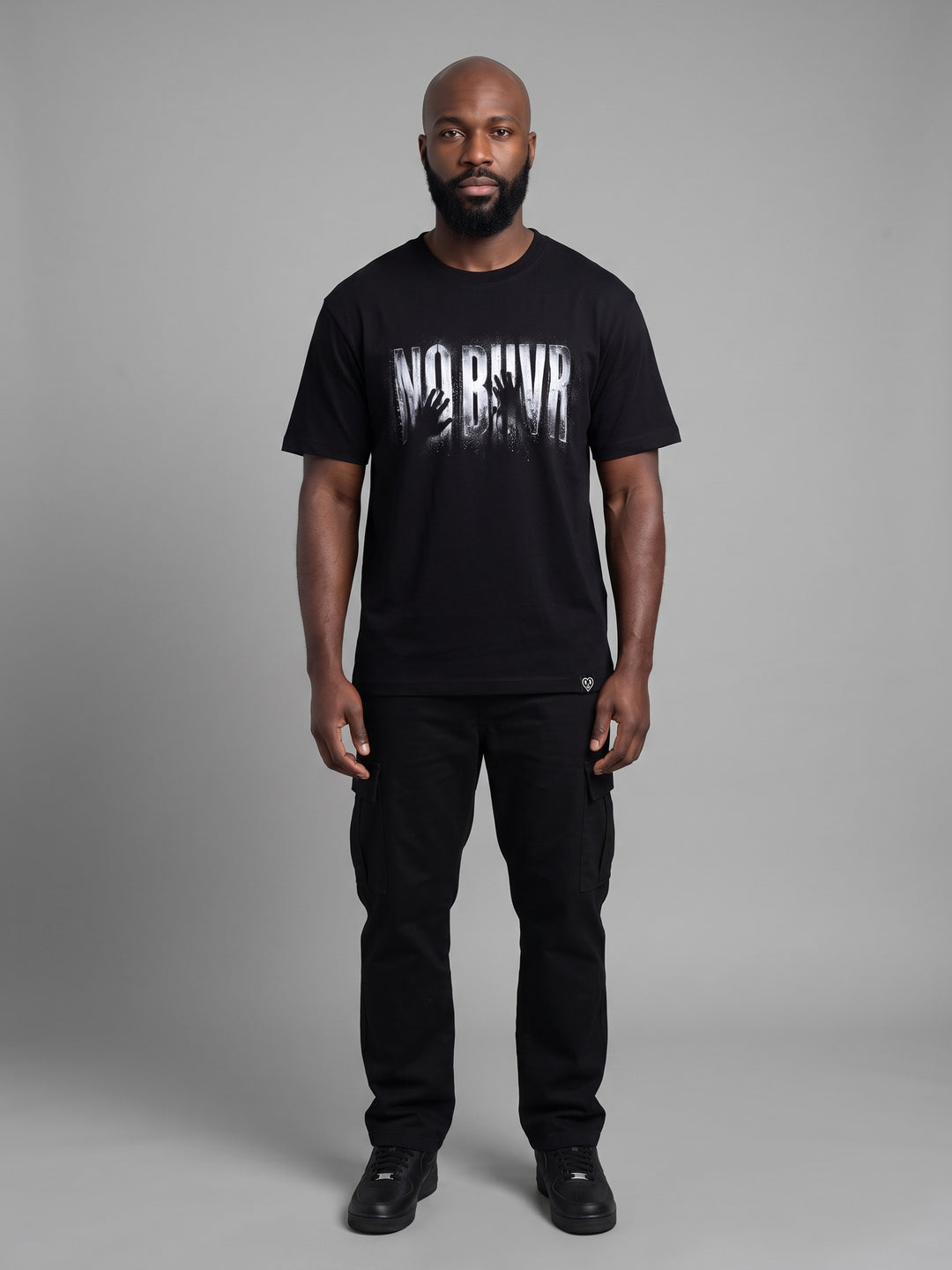 Condensation Hands Tee in black, front view on a model – NO BHVR