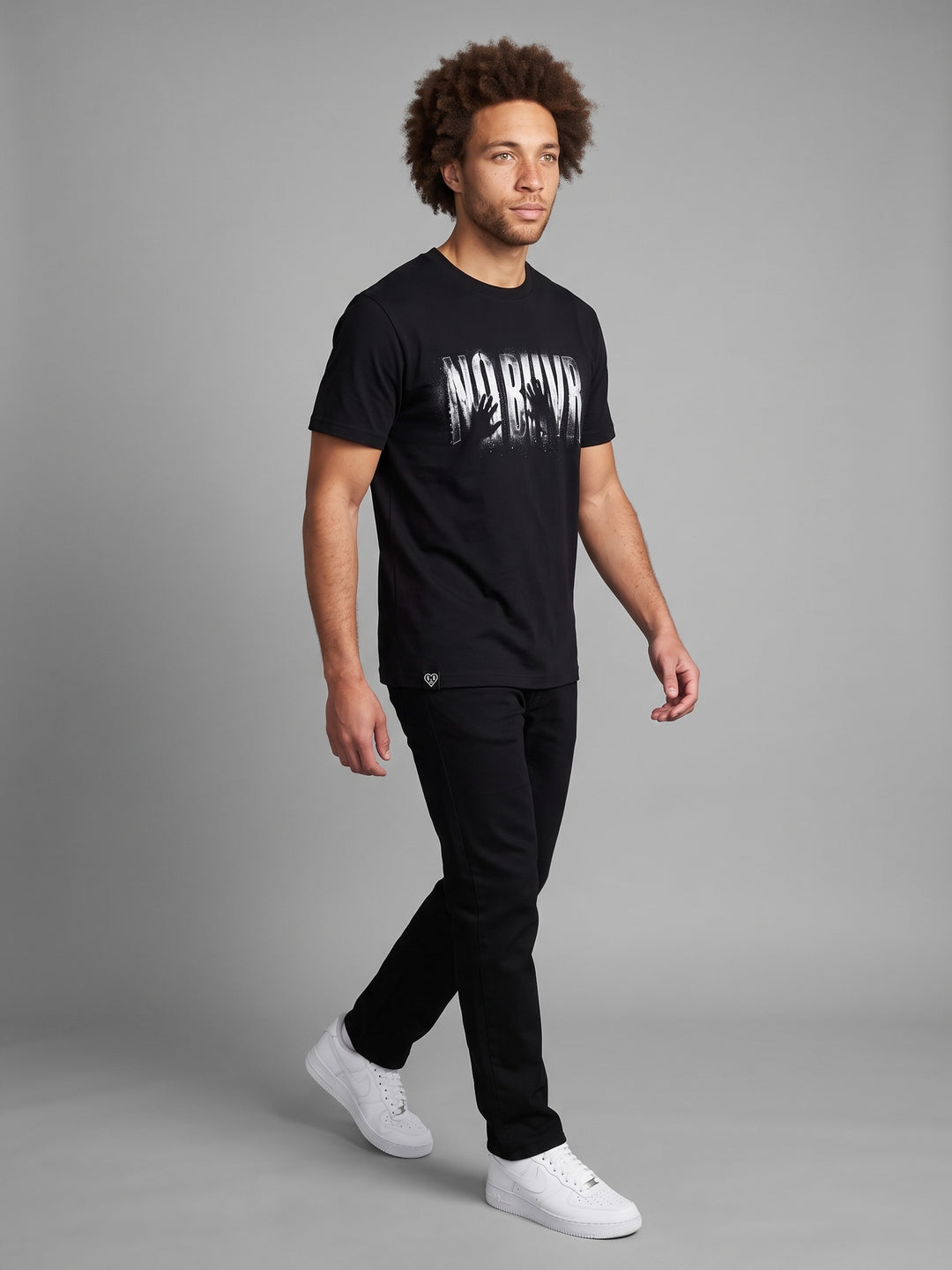 Condensation Lady Tee in black, on a model, walking – NO BHVR