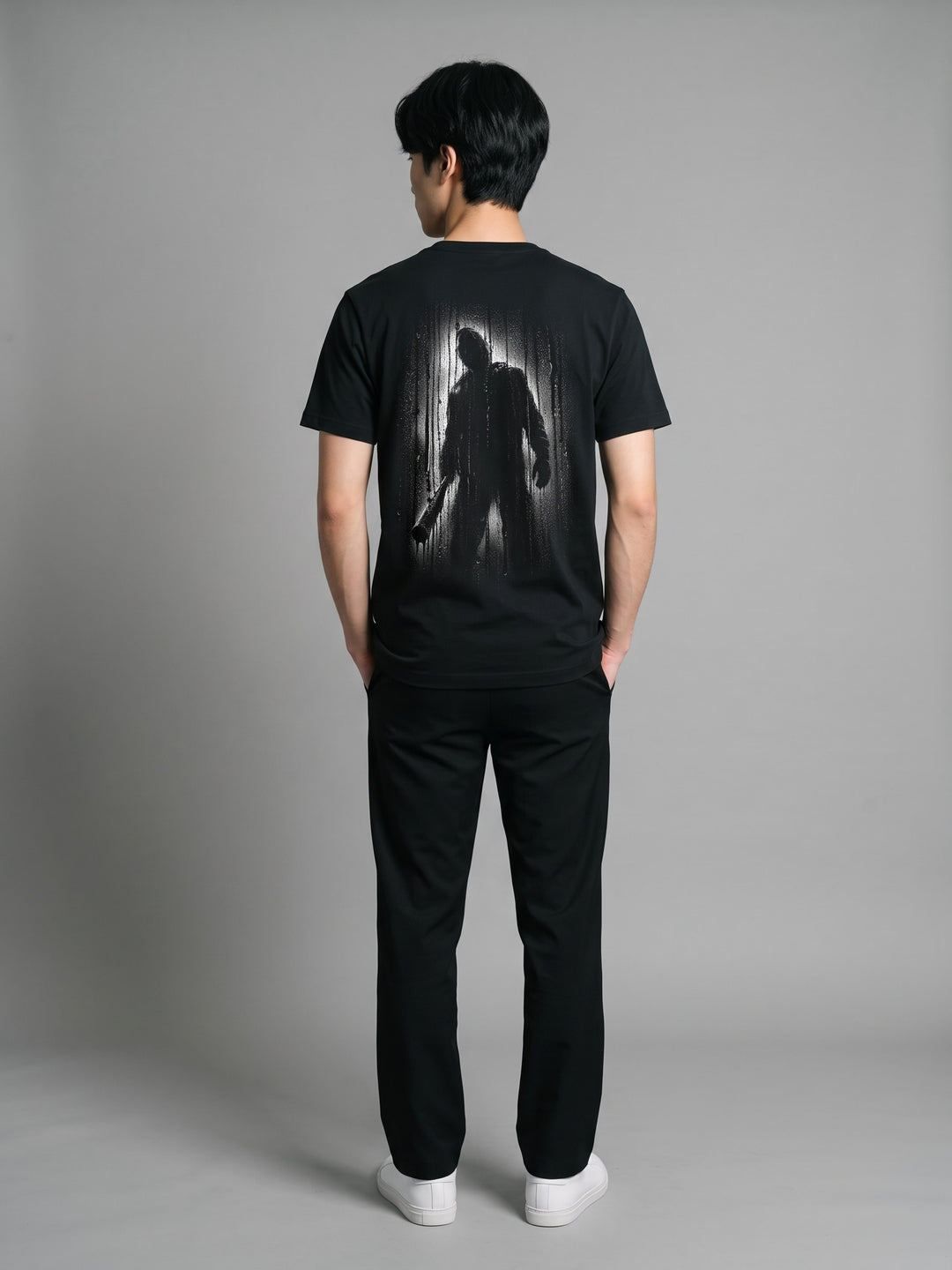 Condensation Man Tee in black, back view on a model – NO BHVR